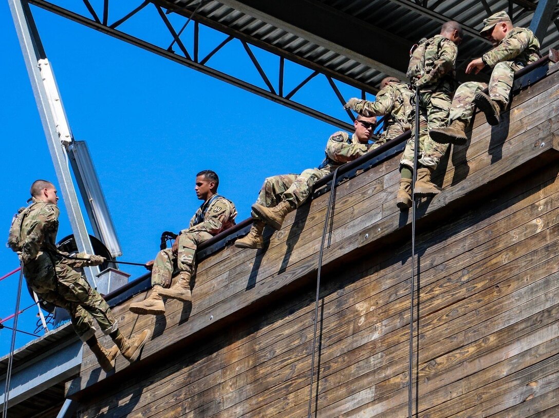 FORT JACKSON, S.C. – Soldiers of Foxtrot Company, 1st Battalion 34th Infantry Regiment prepare to descend the 40 foot wall known as Victory Tower at Fort Jackson, S.C., on Aug. 23, 2016.  The Soldiers of Foxtrot Company are being trained by both U.S. Army Reserve and active duty drill sergeants.  (U.S. Army Reserve photo by Sgt. Michael Adetula, 206th Broadcast Operations Detachment)