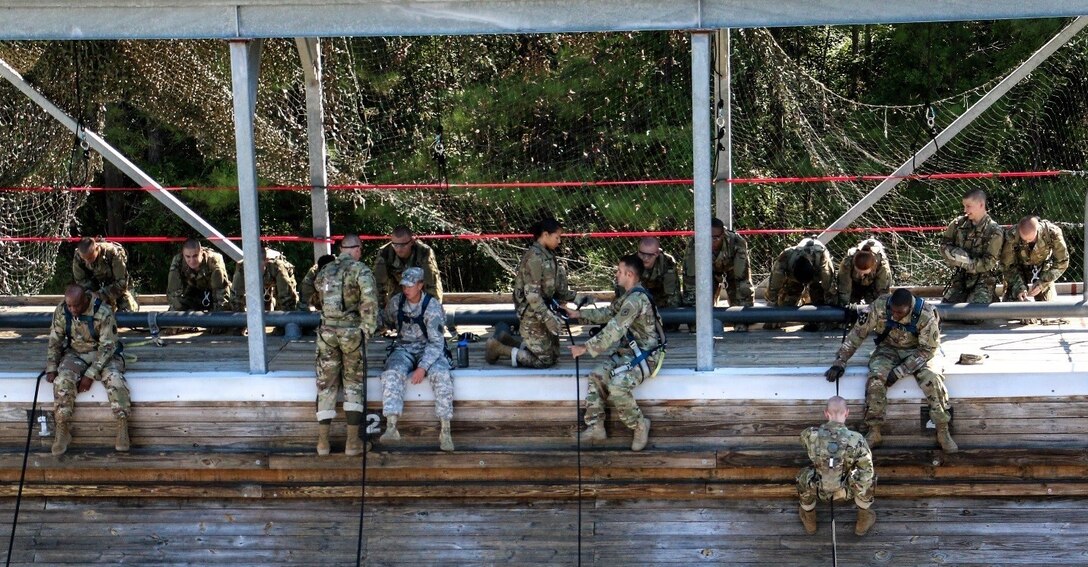 FORT JACKSON, S.C. – Soldiers of Foxtrot Company, 1st Battalion 34th Infantry Regiment descend the mini wall as part of their training at the Victory Tower complex on Aug. 23, 2016.  The training is part of the Army’s Basic Combat Training program instructed by reserve and active duty drill sergeants on Fort Jackson, S.C.  (U.S. Army Reserve photo by Sgt. Michael Adetula, 206th Broadcast Operations Detachment)