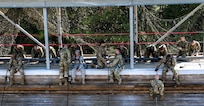 FORT JACKSON, S.C. – Soldiers of Foxtrot Company, 1st Battalion 34th Infantry Regiment descend the mini wall as part of their training at the Victory Tower complex on Aug. 23, 2016.  The training is part of the Army’s Basic Combat Training program instructed by reserve and active duty drill sergeants on Fort Jackson, S.C.  (U.S. Army Reserve photo by Sgt. Michael Adetula, 206th Broadcast Operations Detachment)