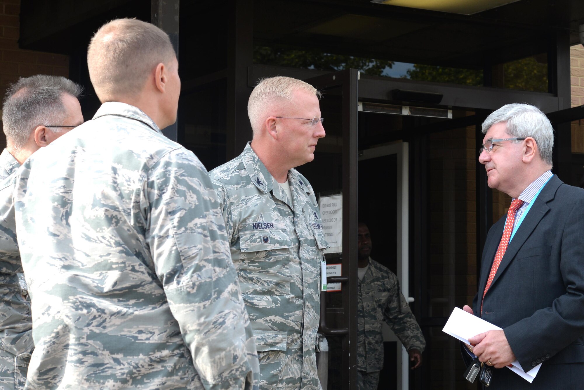 Sir Keith Pearson, National Health Service’s chairman of Health Education England, is greeted by 48th Medical Group leadership at Royal Air Force Lakenheath, England, Aug. 25, 2016. Pearson visited the 48th MDG’s emergency room as well as their simulation center to gain a better understanding of how the Liberty medics train. (U.S. Air Force photo/Airman 1st Class Eli Chevalier)