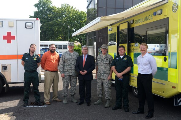 Sir Keith Pearson, the National Health Service’s chairman of Health Education England, takes a photo with members of Southwest Ambulance Services and Liberty medics at Royal Air Force Lakenheath, England, Aug. 25, 2016. Pearson visited the 48th Medical Group to gain a better understanding of how Air Force medics train. (U.S. Air Force photo/Airman 1st Class Eli Chevalier)