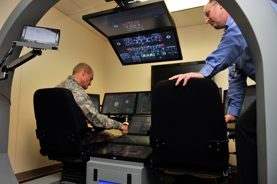 Lt. Gen. Darryl Roberson, commander of Air Education and Training Command, looks at a flight simulator at the C-130J Maintenance Aircrew Training System, Aug. 22, 2016, at Little Rock Air Force Base, Ark. Roberson toured the installation to observe the 314th Airlift Wing‘s role in how the total force concept is employed at Little Rock AFB. (U.S. Air Force photo by Staff Sgt. Regina Edwards)