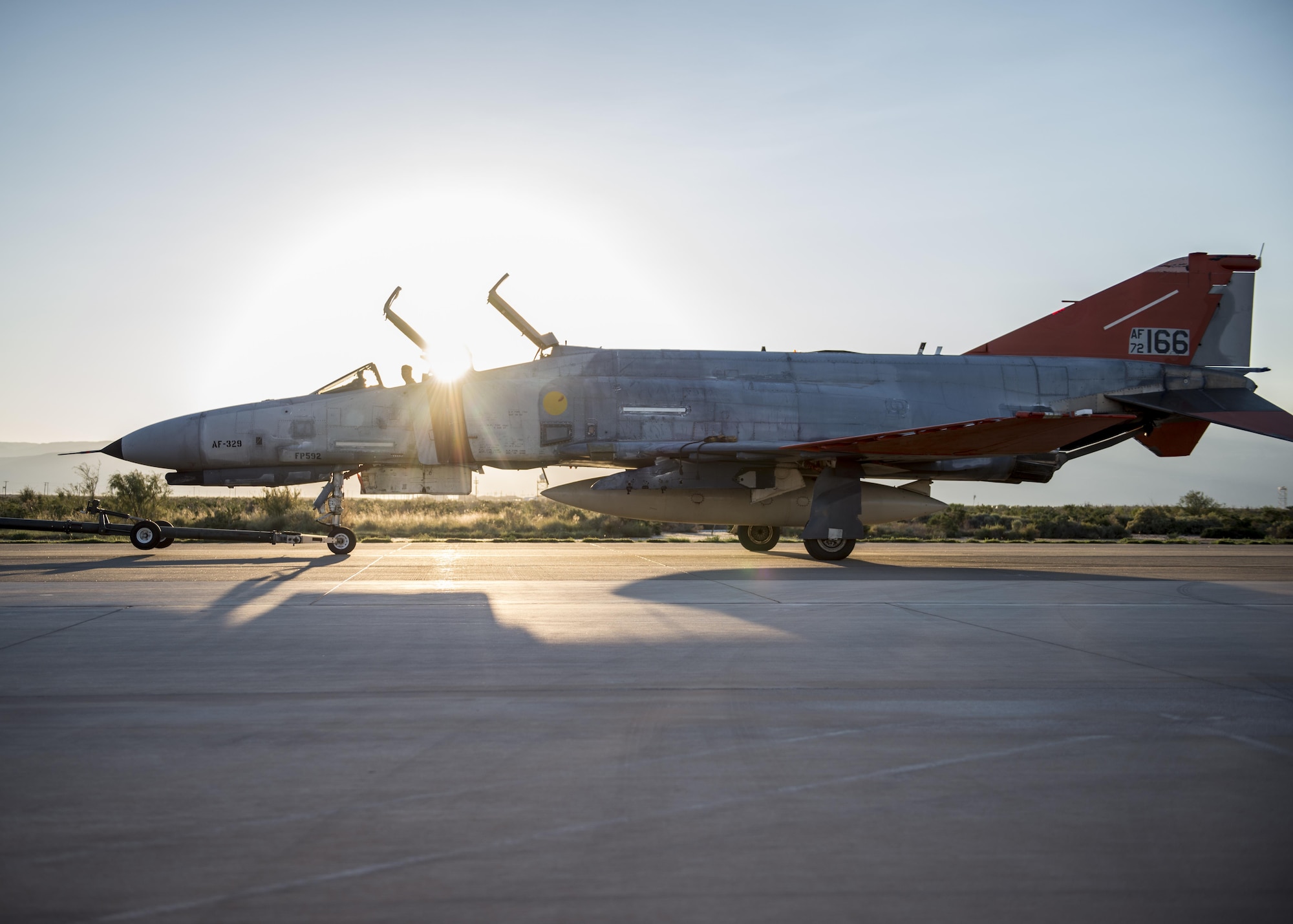 A QF-4 Phantom sits on the flight line before its final unmanned mission at Holloman Air Force Base, N.M. on Aug. 17. During its final mission, the QF-4 served its primary function as an aerial target and was shot at by an F-35 Lightning II from Edwards Air Force Base, Calif. (U.S. Air Force photo by Airman 1st Class Randahl J. Jenson)