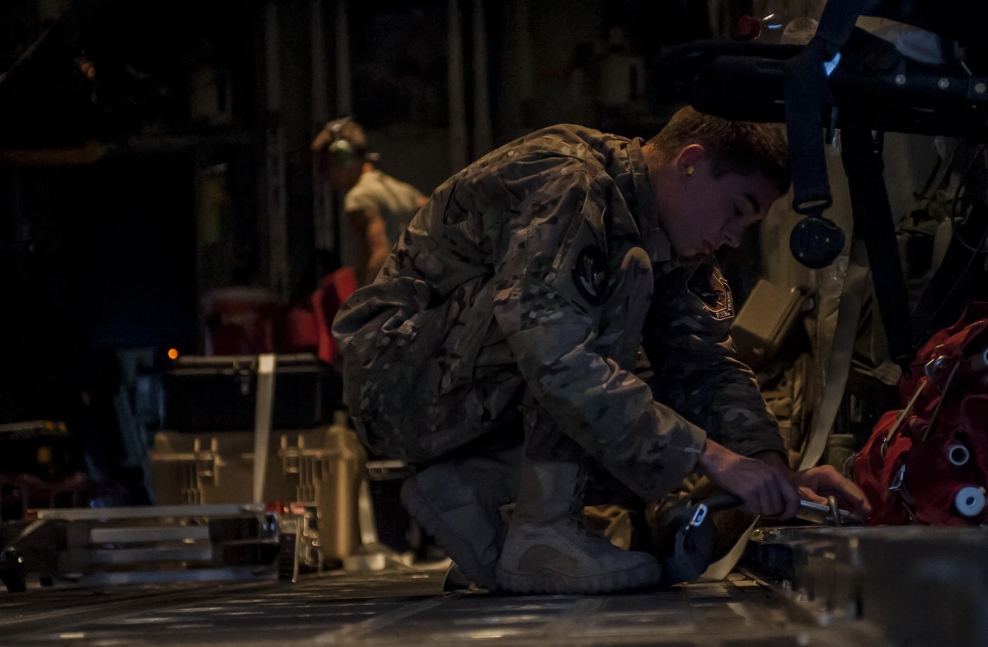 Airmen assigned to the 71st Rescue Squadron, Moody Air Force Base, Georgia, prepare an HC-130J Combat King II for Red Flag 16-4 night operations at Nellis Air Force Base, Nev., Aug. 25, 2016. HC-130J crews normally fly at night at low to medium altitude levels in contested or sensitive environments, both over land or overwater. Crews use night vision goggles for tactical flight profiles to avoid detection to accomplish covert infiltration/exfiltration and transload operations. (U.S. Air Force photo by Airman 1st Class Kevin Tanenbaum/Released)