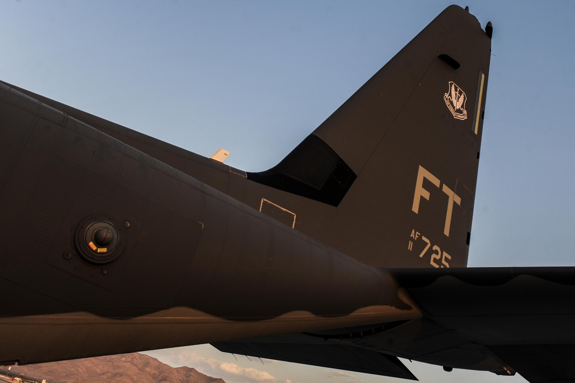 An HC-130J Combat King II assigned to the 71st Rescue Squadron, Moody Air Force, Georgia, sits on the flightline before Red Flag 16-4 night operations at Nellis Air Force Base, Nev., Aug. 25, 2016. Red Flag involves a variety of attack, fighter, bomber, reconnaissance, electronic warfare, airlift support, and search and rescue aircraft. (U.S. Air Force photo by Airman 1st Class Kevin Tanenbaum/Released)