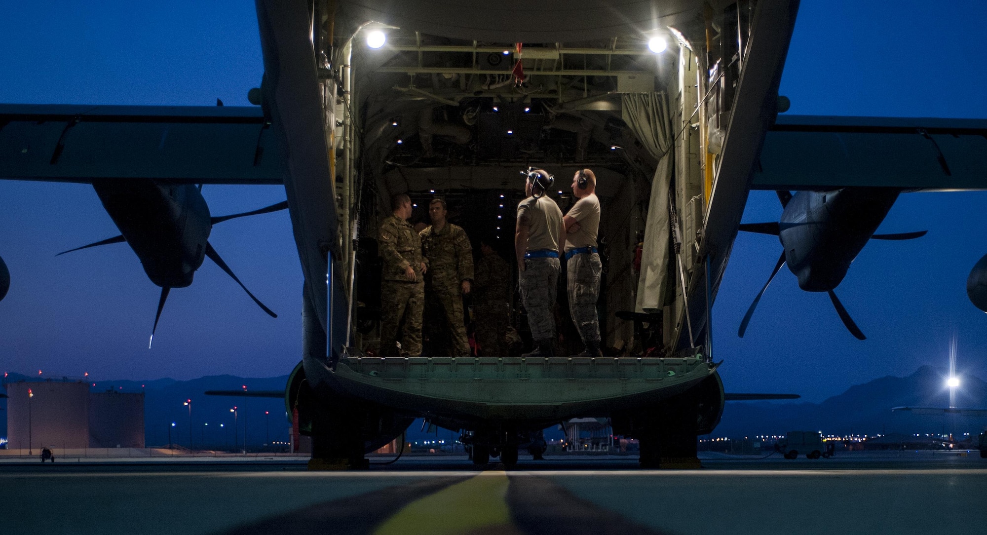 Airmen assigned to the 71st Rescue Squadron, Moody Air Force Base, Georgia, prepare the cargo area of a HC-130J Combat King II for night operations at Nellis Air Force Base, Nev., Aug. 25, 2016. Red Flag is a realistic combat exercise involving multiple military branches conducting training operations on the 15,000 square mile Nevada Test and Training Range. (U.S. Air Force photo by Airman 1st Class Kevin Tanenbaum/Released)