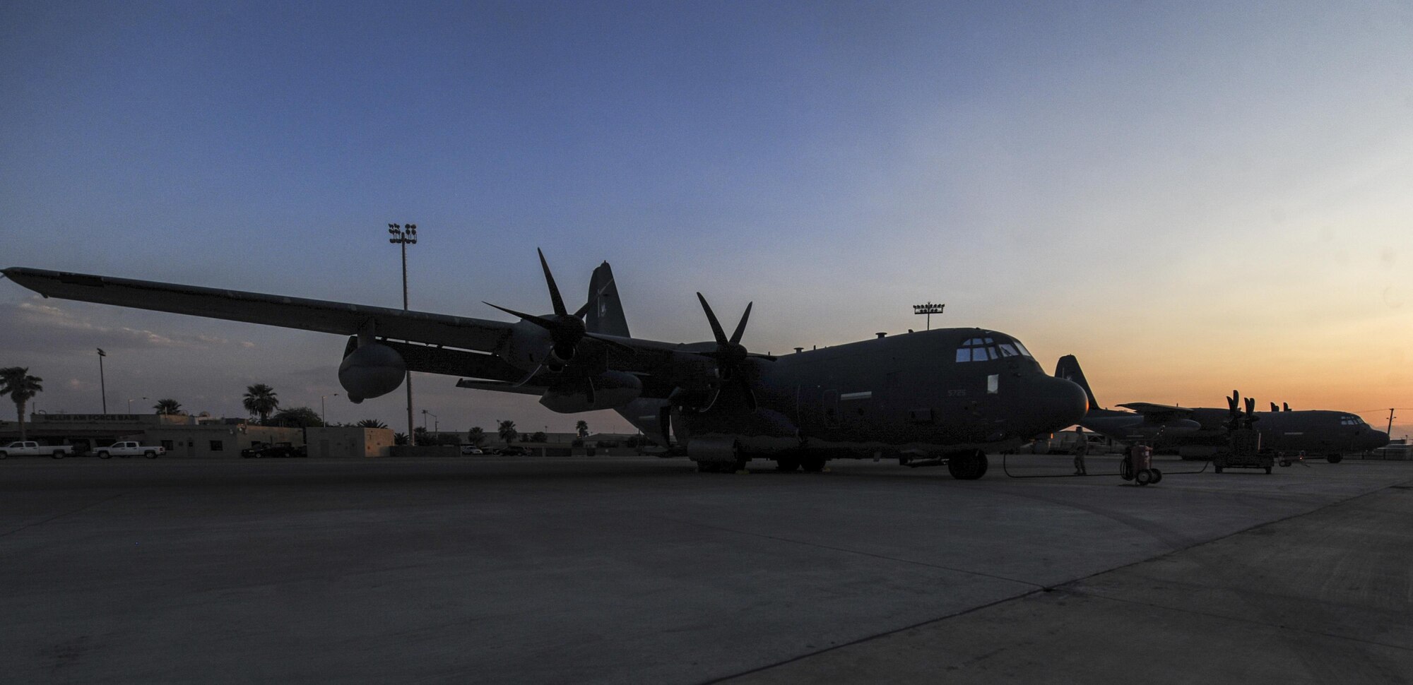 HC-130J Combat King IIs assigned to the 71st Rescue Squadron, Moody Air Force Base, Georgia, undergoes preflight preparation on the flightline before Red Flag 16-4 night operations at Nellis Air Force Base, Nev., Aug. 25, 2016. Red Flag missions are conducted 2.9 million acres of the Nevada Test and Training Range with 1,900 possible targets, realistic threat systems and opposing enemy forces. (U.S. Air Force photo by Airman 1st Class Kevin Tanenbaum/Released)