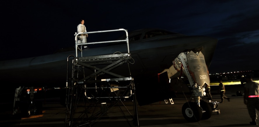 U.S. Air Force Staff Sgt. Loverta DeGraitis, an aerospace propulsion craftsman assigned to the 509th Aircraft Maintenance Squadron, stands atop a B-2 Spirit to perform post-flight inspections on the aircraft Aug. 24, 2016 at Andersen Air Force Base, Guam. U.S. Strategic Command forces operate 24-hours-a-day, seven-days-a-week detecting and deterring strategic attack against the U.S. and our allies. (U.S. Air Force photo by Senior Airman Jovan Banks)
