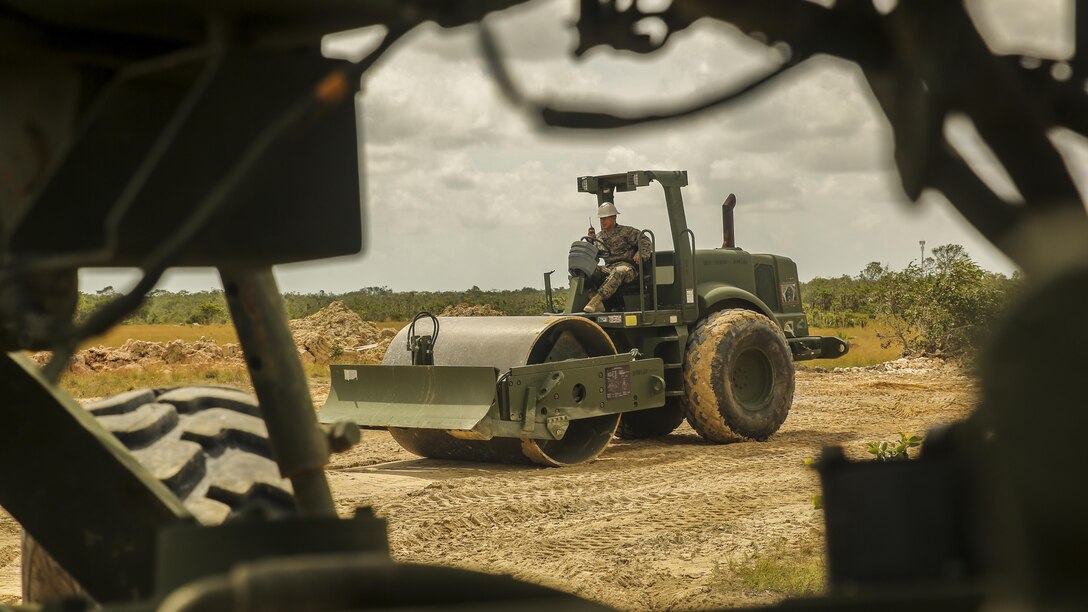 A U.S. Marine with Marine Wing Support Detachment 31, in support of Special Purpose Marine Air-Ground Task Force - Southern Command, waits for further instruction to use a CP44 Compacter at the Hattieville Range Complex in Hattieville, Belize, Aug. 24, 2016. Over the next several months, Marines from MWSD-31 will be working on several engineer projects in Belize, which will help to increase partner nation capacity and strengthen regional defense and security cooperation.