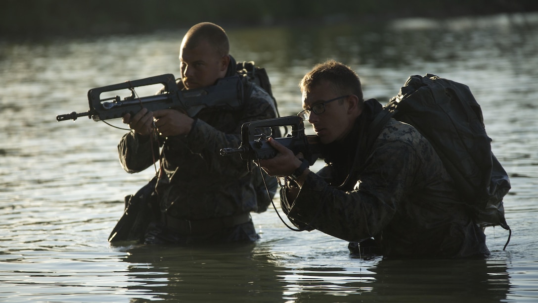 Cpl. Richard J. Moye, left, a rifleman, and Lance Cpl. Michael J. Aaron, right, a rifleman, conduct a tactical shore insertion off the coast of Noumea, New Caledonia, August 18, 2016. The Marines are in New Caledonia participating in a French Nautical Commando Course which consists of various water survival and tactical training. The course is a part of Exercise AmeriCal 16, a bilateral training exercise designed to enhance mutual combat capabilities and improve relations between the U.S. Marine Corps and the French Armed Forces. Moye, from Pensacola, Florida, and Aaron from Grand Ronde, Oregon, are with Marine Rotational Force – Darwin.