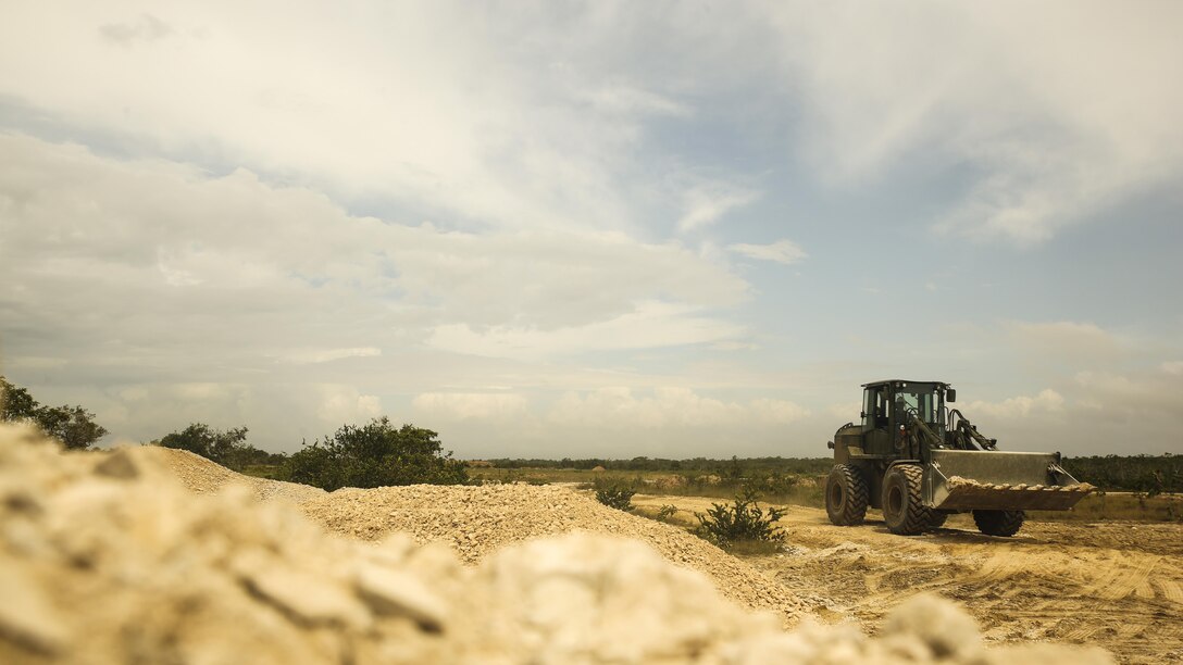 A U.S. Marine with Marine Wing Support Detachment 31, in support of Special Purpose Marine Air-Ground Task Force - Southern Command, uses a 624KR TRAM to spread road building material at the Hattieville Range Complex in Hattieville, Belize, Aug. 24, 2016. Over the next several months, Marines from MWSD-31 will be working on several engineer projects in Belize, which will help to increase partner nation capacity and strengthen regional defense and security cooperation.