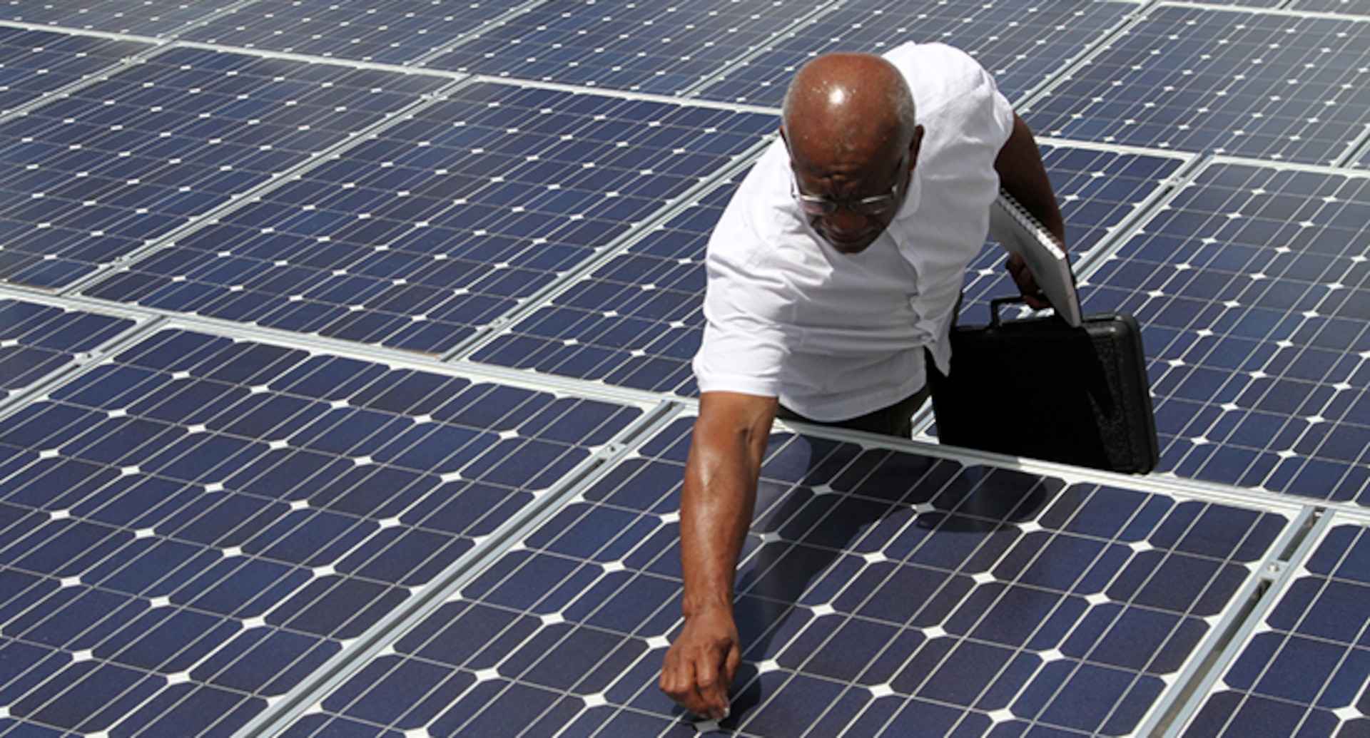 Ronald Gooch, energy specialist for the Ohio Adjutant General’s Department, inspects one of the more than 300 solar panels at the Maj. Gen. Robert S. Beightler Armory Aug. 11, 2016, in Columbus, Ohio. Solar power has been a part of the Ohio National Guard’s efforts to reduce energy consumption since 2009, with solar arrays currently at seven facilities throughout the state and plans to expand further.