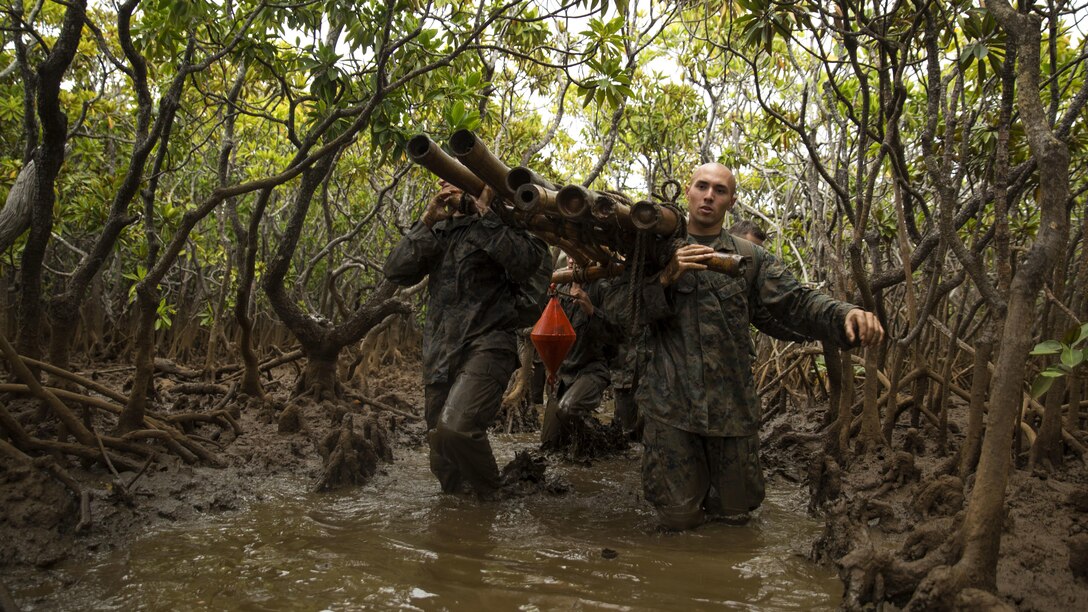 Marines with Marine Rotational Force – Darwin transport a water raft through mangroves during a French Armed Forces Nautical Commando Course in Noumea, New Caledonia, August 22, 2016. The course is a part of Exercise AmeriCal 16, a bilateral training exercise designed to enhance mutual combat capabilities and improve relations between the U.S. Marine Corps and the French Armed Forces.
