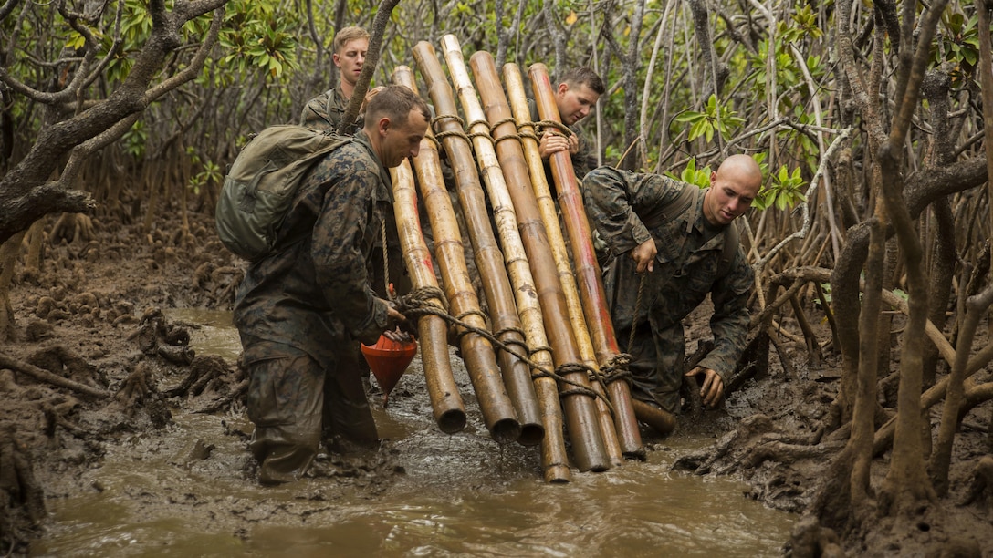 Marines with Marine Rotational Force – Darwin transport a water raft through mangroves during a French Armed Forces Nautical Commando Course in Noumea, New Caledonia, August 22, 2016. The course is a part of Exercise AmeriCal 16, a bilateral training exercise designed to enhance mutual combat capabilities and improve relations between the U.S. Marine Corps and the French Armed Forces.