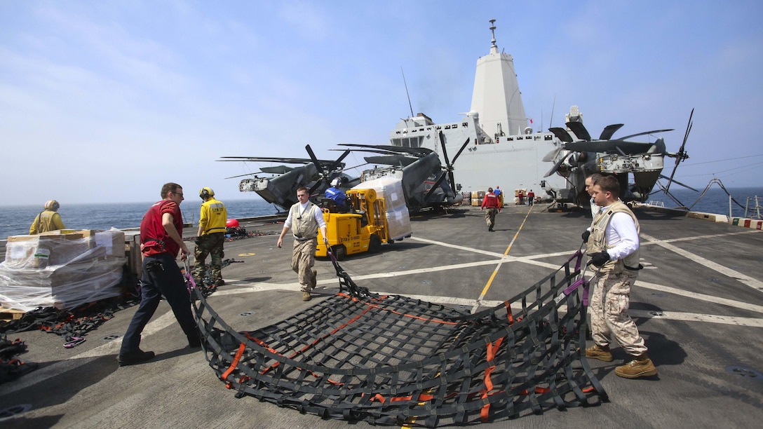 U.S. Marines from 22nd Marine Expeditionary Unit and U.S. Navy sailors from the amphibious transport dock ship USS San Antonio conduct a replenishment-at-sea Aug. 28, 2016, bringing shipments of food, mail and supplies aboard the ship. 