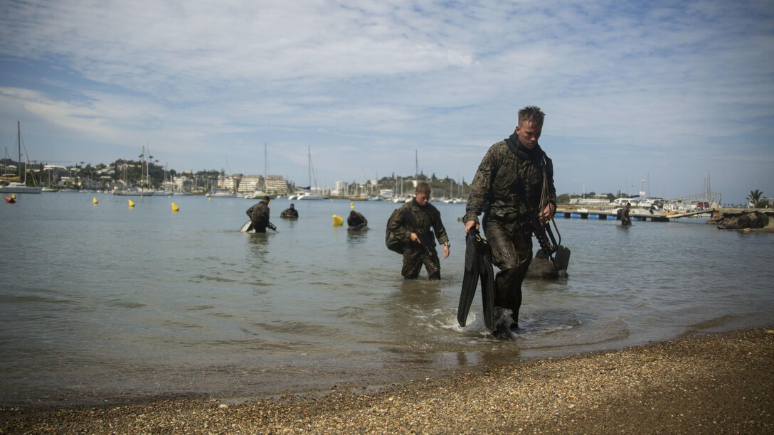 Marines with Marine Rotational Force – Darwin return to shore after a 1,200 meter swim off the coast of Noumea, New Caledonia, August 18, 2016. The Marines are in New Caledonia participating in a French Nautical Commando Course which consists of various water survival and tactical training. The course is a part of Exercise AmeriCal 16, a bilateral training exercise designed to enhance mutual combat capabilities and improve relations between the U.S. Marine Corps and the French Armed Forces.