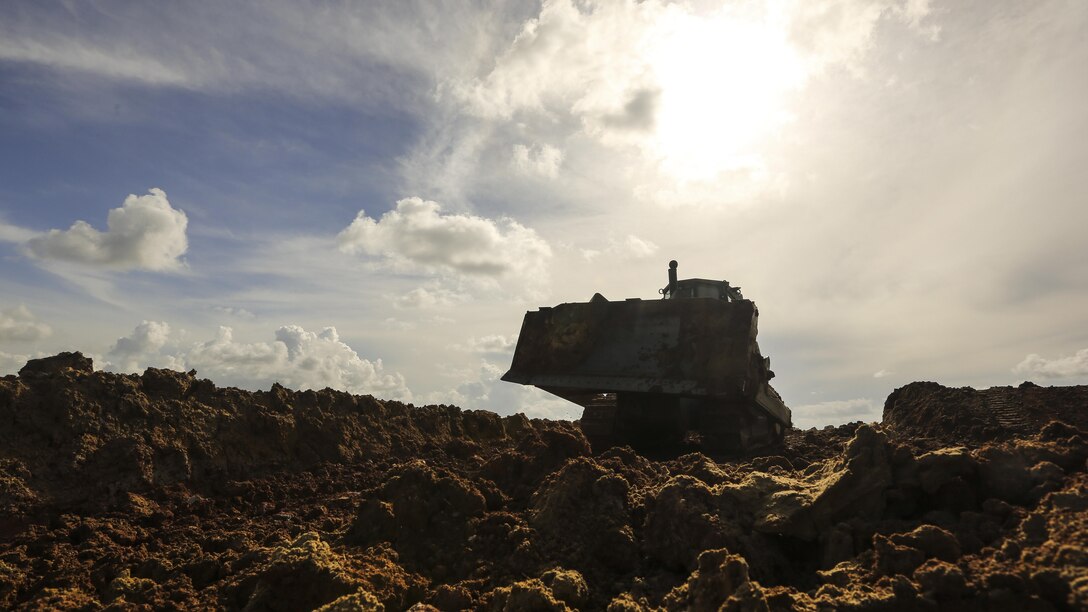 A U.S. Marine with Marine Wing Support Detachment 31, in support of Special Purpose Marine Air-Ground Task Force - Southern Command, prepares to excavate surrounding dirt with a 850JR MCT at the Hattieville Range Complex in Hattieville, Belize, Aug. 24, 2016. Over the next several months, Marines from MWSD-31 will be working on several engineer projects in Belize, which will help to increase partner nation capacity and strengthen regional defense and security cooperation.