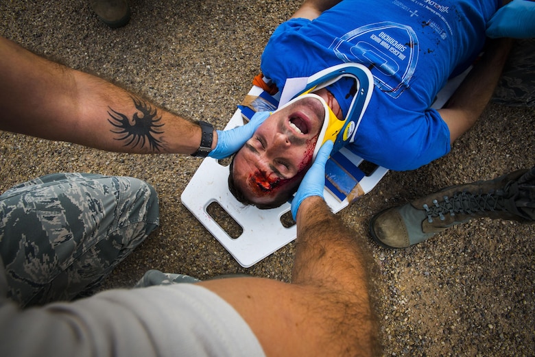 Emergency Medical Technicians from Offutt Air Force Base, Neb., treat a car accident trauma patient during the 2016 EMT Rodeo Aug. 25, 2016, at Cannon Air Force Base, N.M. Cannon’s EMT Rodeo tests the skills of medical professionals from across the Air Force through a series of innovative high-pressure scenarios. (U.S. Air Force photo by Staff Sgt. Eboni Reams/Released)