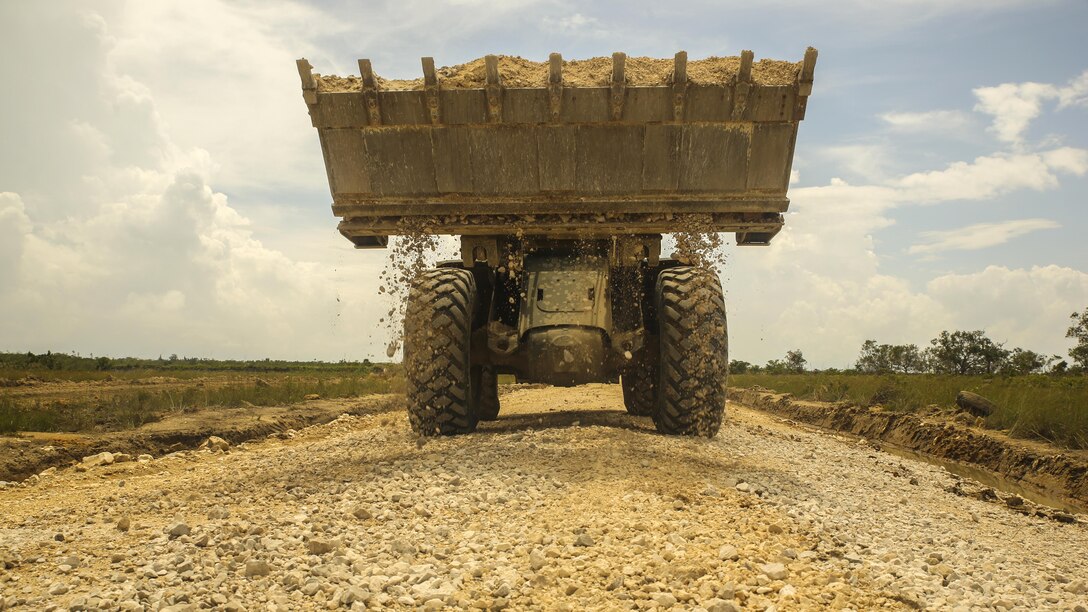 A U.S. Marine with Marine Wing Support Detachment 31, in support of Special Purpose Marine Air-Ground Task Force - Southern Command, uses a 624KR TRAM to spread load material onto a road under development at the Hattieville Range Complex in Hattieville, Belize, Aug. 24, 2016. Over the next several months, Marines from MWSD-31 will be working on several engineer projects in Belize, which will help to increase partner nation capacity and strengthen regional defense and security cooperation.