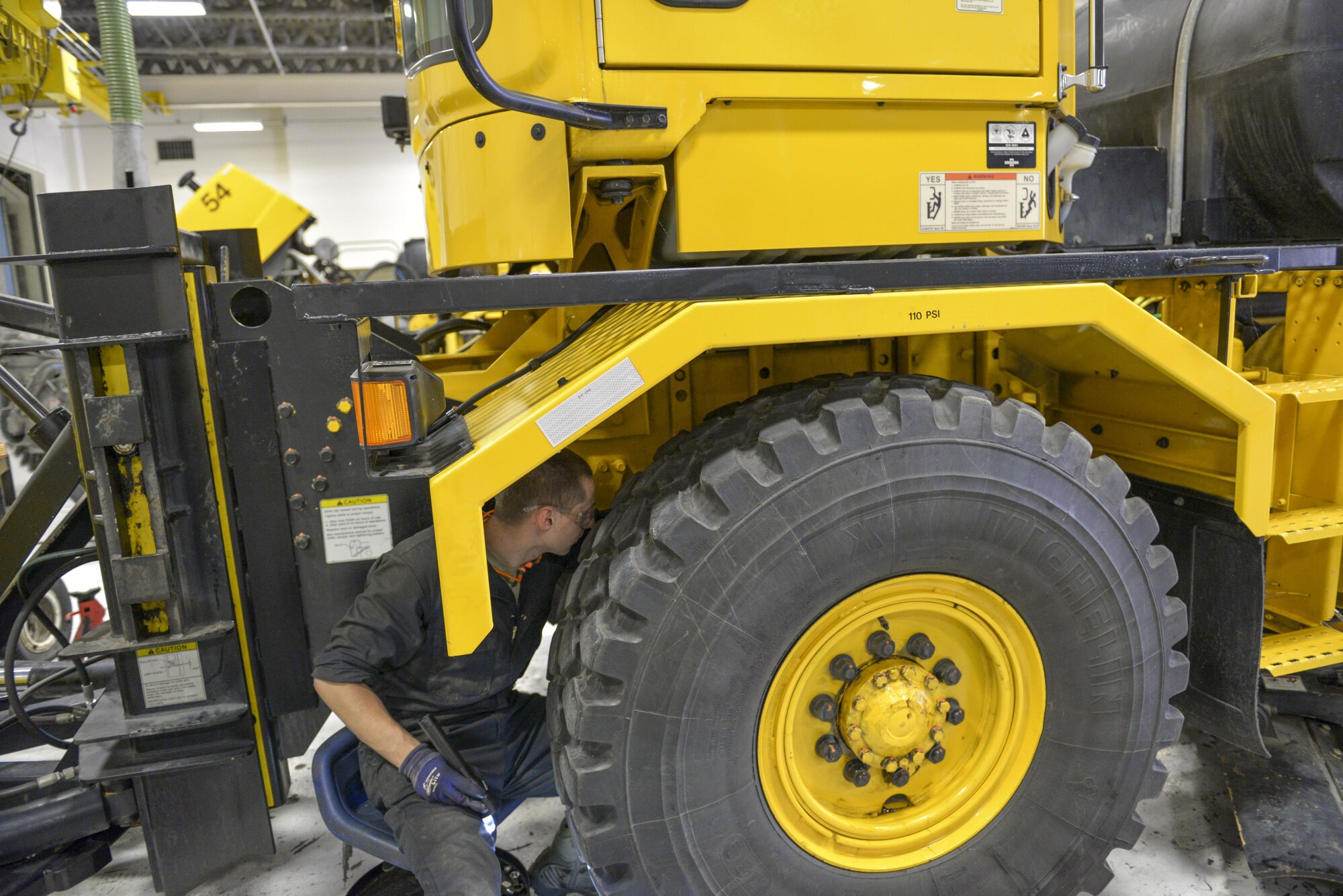 U.S. Air Force Airman 1st Class Timothy Fitzpatrick, a 354th Logistics Readiness Squadron vehicle maintenance journeyman, reroutes an electrical wire on a snow plow Aug. 26, 2016, at Eielson Air Force Base, Alaska. The wires have to be fixed occasionally due to damage from weather. (U.S. Air Force photo by Airman Isaac Johnson)
