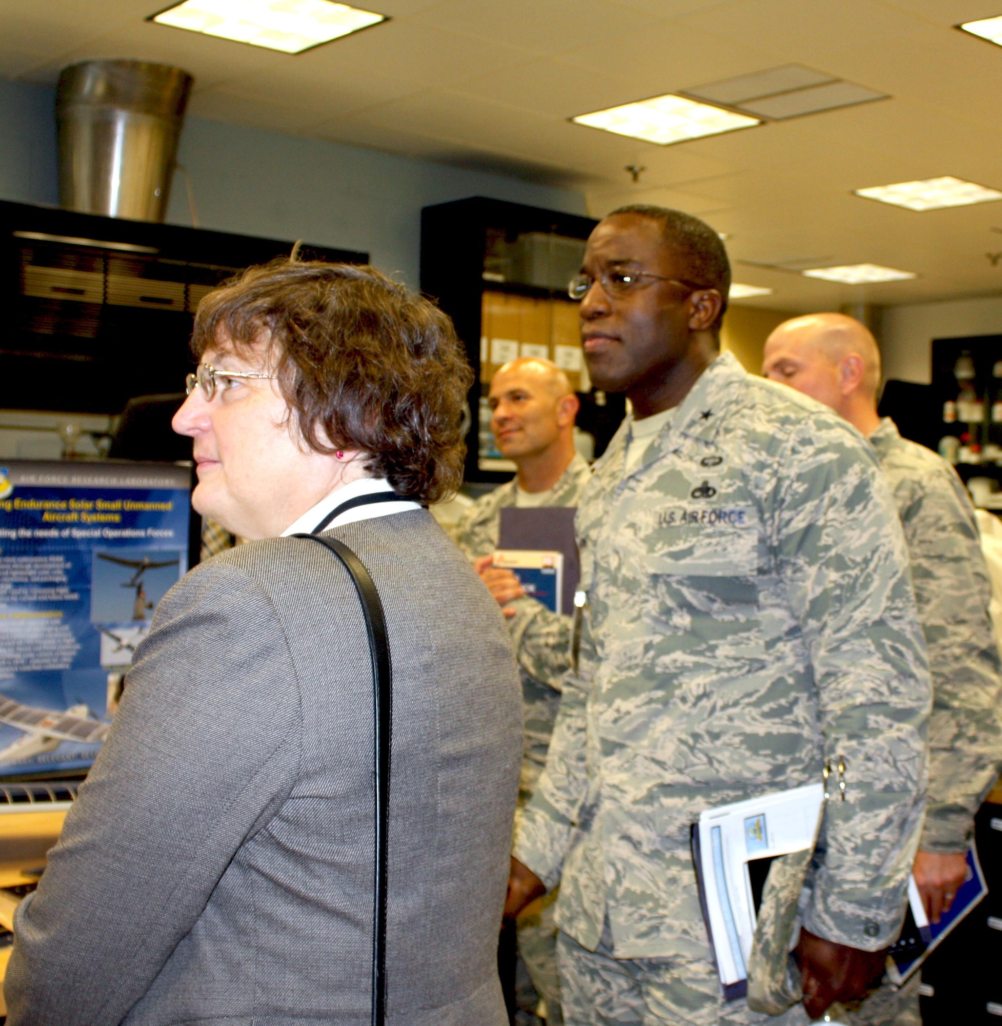 WRIGHT-PATTERSON AIR FORCE BASE, Ohio – Brig. Gen. Stacey T. Hawkins, Director, Logistcs, Engineering and Force Protection, Air Mobility Command (right) and Dr. Donna C. Senft, Chief Scientist, Air Mobility Command, along with core members of the AMC aircraft maintenance team visited the Materials and Manufacturing Directorate, Air Force Research Laboratory, to gain in-depth knowledge of additive manufacturing capabilities and technologies, Aug. 26. The visit included a directorate overview, discussions on additive manufacturing applications and visits to multiple research laboratories, highlighting 3-D printing capabilities for metals, polymer-based materials and functional material applications. AMC is exploring the possibilities of using additive manufacturing for replacement parts for aircraft during the life-cycle maintenance process. (Air Force photo by Marisa Novobilski/released) 