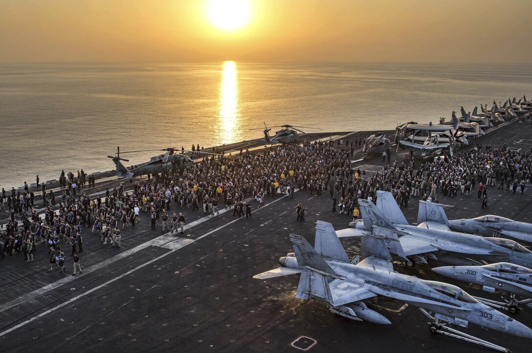 Sailors on the USS Dwight D. Eisenhower participate in the Out of the Darkness Community Walk on the flight deck to increase awareness for suicide prevention while at sea in the Arabian Gulf, Aug. 26, 2016. The Eisenhower is supporting Operation Inherent Resolve, maritime security operations and theater security cooperation efforts in the U.S. 5th Fleet area of operations. Navy photo by Petty Officer 3rd Class Casey J. Hopkins