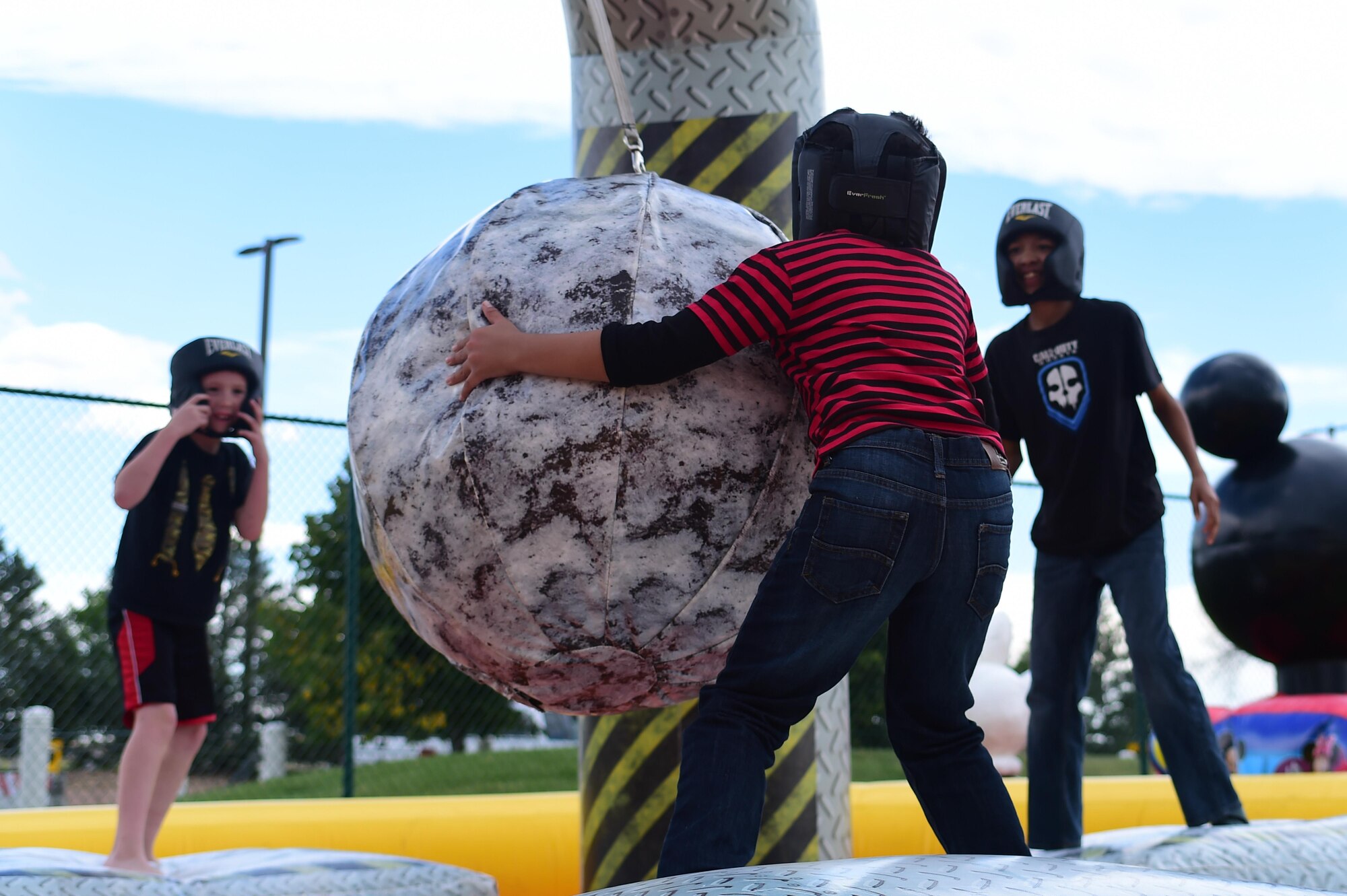 Children from Buckley Air Force Base play on one of the inflatable games at FunFest Aug. 26, 2016, on Buckley AFB, Colo.  FunFest is an annual community fair that provides a variety of attractions for all ages. (U.S. Air Force photo by Senior Airman Luke W. Nowakowski/Released)