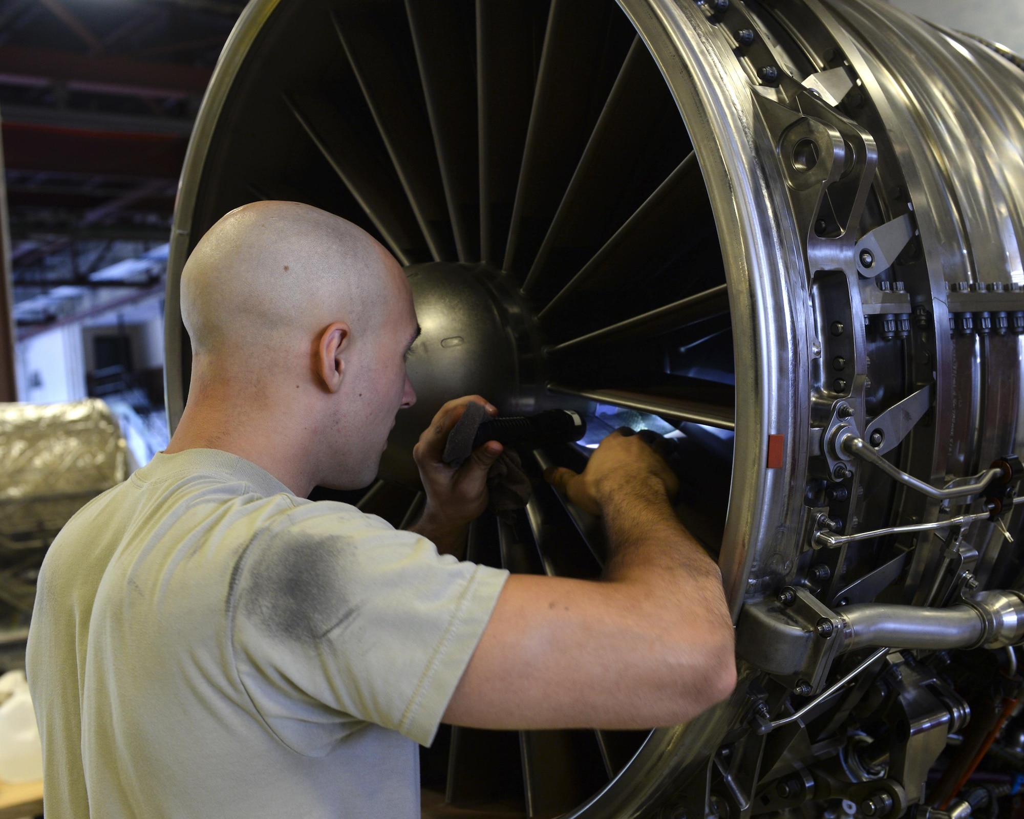 U.S. Air Force Airman 1st Class Tyler Covington, 325th Maintenance Squadron aerospace propulsion technician, performs maintenance on the blades of an F-119 engine in the Propulsion Flight hangar at Tyndall Air Force Base, Fla., Aug. 29, 2016. The Airmen of Tyndall’s Propulsion Flight inspect and maintain the engines used in the F-22 Raptor to ensure the jets are always mission-ready. (U.S. Air Force photo by Airman 1st Class Cody R. Miller/Released)