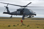 Technical Sgt. Cody Inman, a pararescueman with the 212th Rescue Squadron, Joint Base Elmendorf-Richardson, Alaska, is hoisted into a HH-60 Pavehawk helicopter during Exercise Arctic Chinook Aug. 24, 2016. Exercise Arctic Chinook is a joint U.S. Coast Guard and U.S. Northern Command-sponsored exercise on the U.S. State Department approved list of Arctic Council Chairmanship events. The Arctic mass rescue operation exercise scenario consisted of an adventure-class cruise ship with approximately 200 passengers and crew that experience a catastrophic event with the need to abandon ship. Arctic Chinook exercised elements of the Arctic Search and Rescue Agreement to include interoperability, cooperation, information sharing, SAR services, and joint exercise review. 