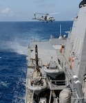 An MH-60R Seahawk, attached to the Warbirds detachment of Helicopter Maritime Strike Squadron (HSM) 49, launches from the flight deck of the guided-missile destroyer USS Momsen (DDG 92) during transit of the South China Sea, Aug. 24, 2016.  The guided-missile destroyers USS Spruance (DDG 111), USS Decatur (DDG 73) and Momsen are deployed in support of maritime security and stability in the Indo-Asia-Pacific as part of a U.S. 3rd Fleet Pacific Surface Action Group (PAC SAG) under Commander, Destroyer Squadron (CDS) 31.