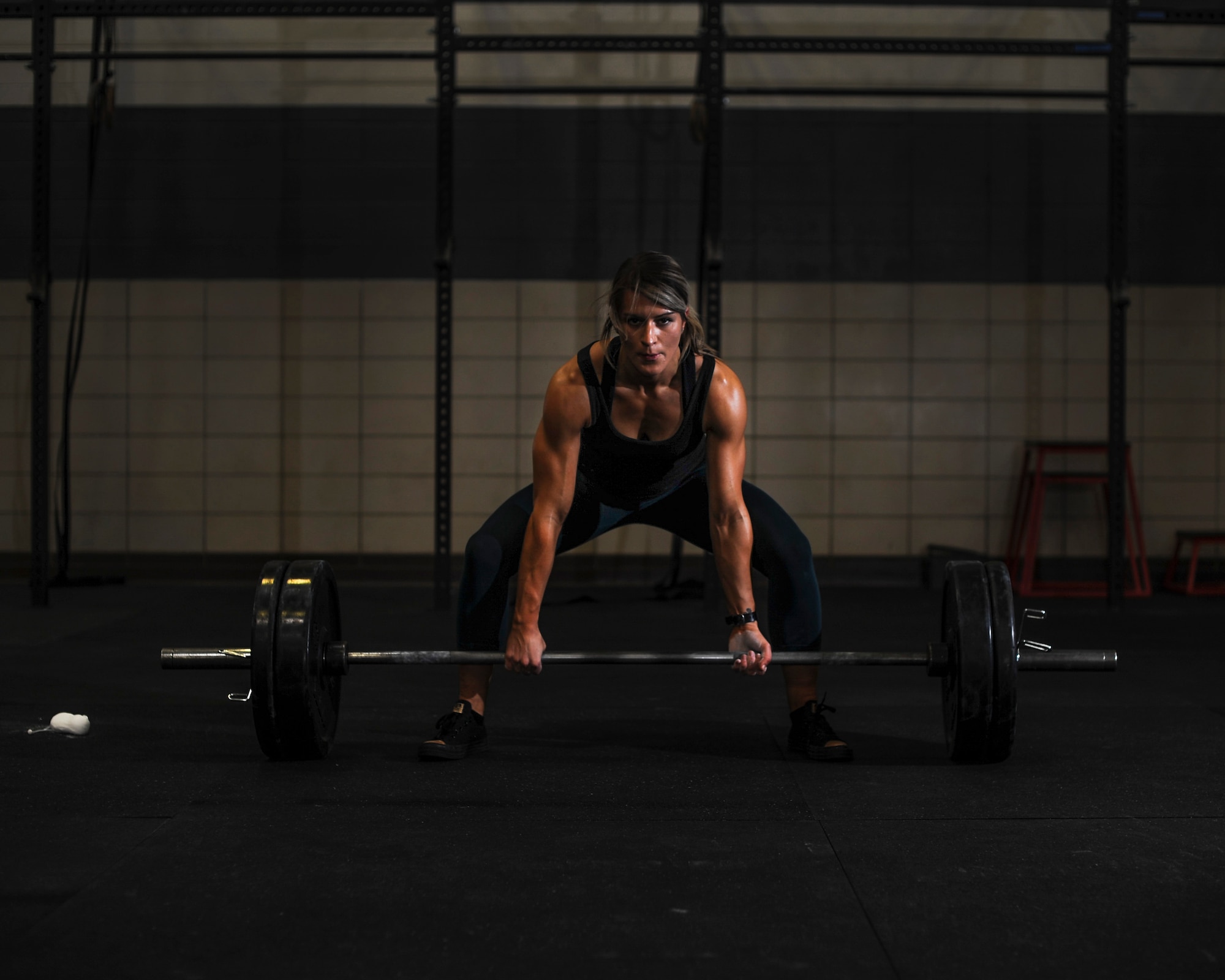 U.S. Air Force Staff Sgt. Macy Benjamin, 355th Contracting Squadron contract administrator, prepares to perform a dead lift at the Haeffner Fitness and Sports Center at Davis-Monthan Air Force Base, Ariz., Aug. 25, 2016. Benjamin uses weightlifting as a personal escape from everyday stressors. (U.S. Air Force photo by Airman 1st Class Ashley N. Steffen)