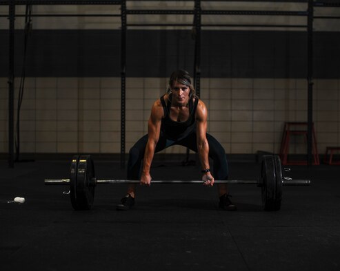 U.S. Air Force Staff Sgt. Macy Benjamin, 355th Contracting Squadron contract administrator, prepares to perform a dead lift at the Haeffner Fitness and Sports Center at Davis-Monthan Air Force Base, Ariz., Aug. 25, 2016. Benjamin uses weightlifting as a personal escape from everyday stressors. (U.S. Air Force photo by Airman 1st Class Ashley N. Steffen)