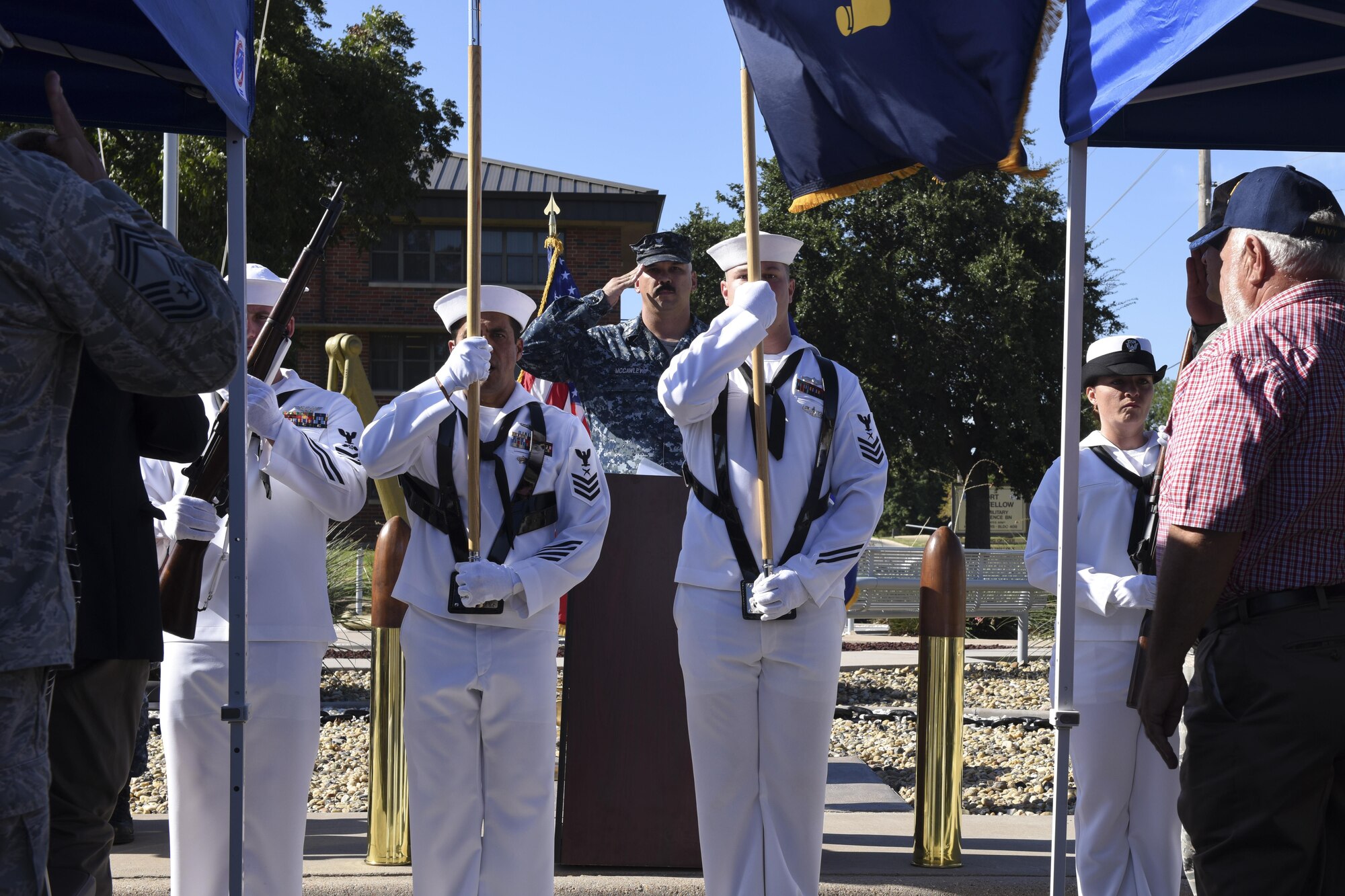U.S. Navy Petty Officer 1st Class Jacob McCawley, Center for Information Dominance Detachment instructor, salutes at the Liberty Memorial on Goodfellow Air Force Base, Texas, Aug. 26. The ceremony honored the detachment’s and Goodfellow’s 50 yearlong relationship. (U.S. Air Force photo by Airman 1st Class Chase Sousa/Released)