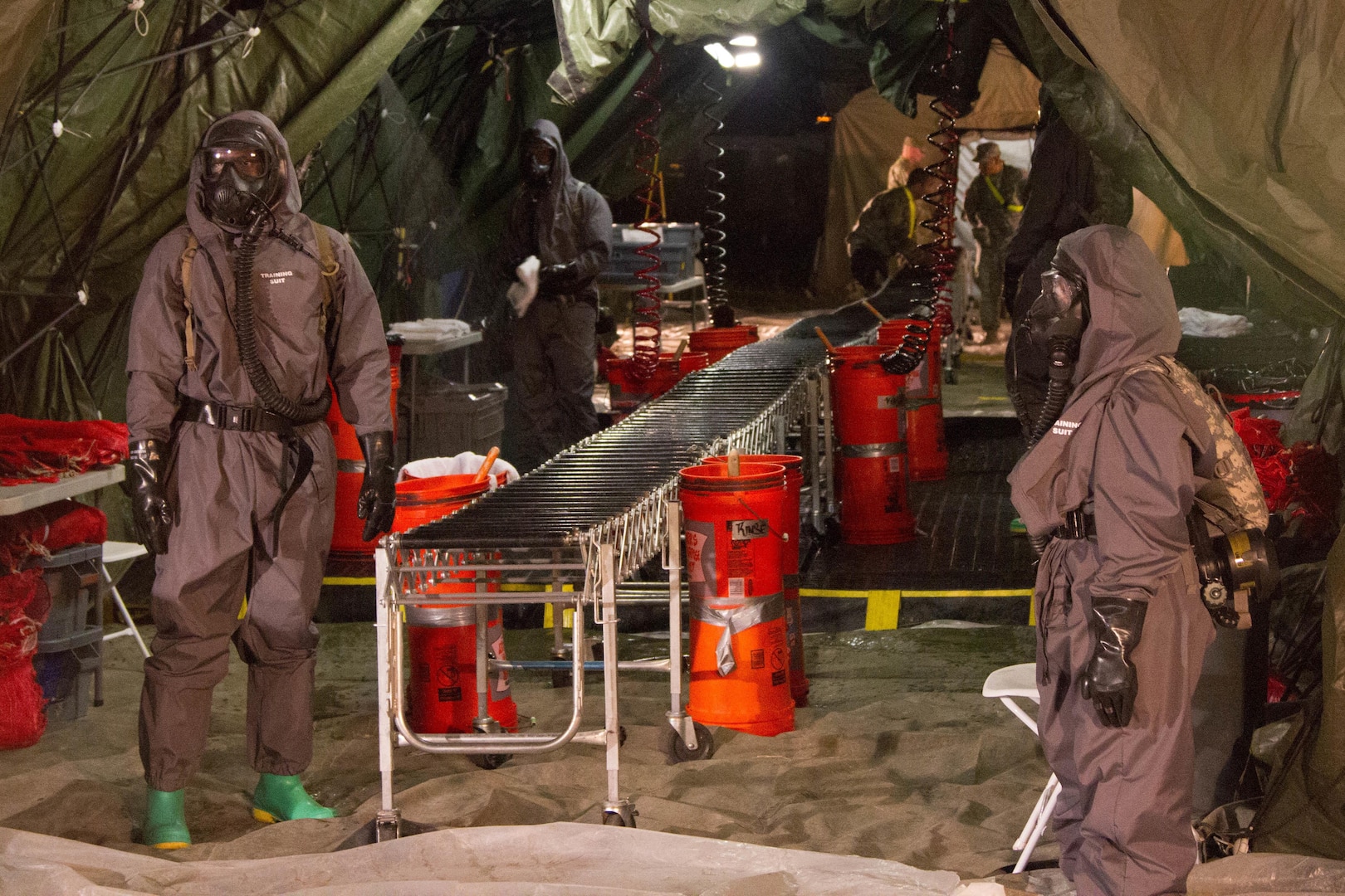 Soldiers with the 172nd Hazard Response Company from Fort Riley, Kansas prepare for a decontamination training exercise August 25, 2016 at Fort Hood, Texas during Sudden Response 16, a weeklong training event for various units within Joint Task Force Civil Support, a rapidly deployable force of more than 5,000 service members from across the country who are specially trained and equipped to provide life-saving assistance in the event of chemical, biological, radiological or nuclear disasters in the U.S. The training exercise included 200 civilian role players who acted as injured survivors of a nuclear blast. (U.S. Army photo by Sgt. Marcus Floyd, 13th Public Affairs Detachment)