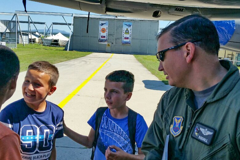 U.S. Air Force Capt. David McClintic, a B-52H Stratofortress aircrew member from the 11th Bomb Squadron, answers questions from a group of Slovakian school students during a tour of the bomber on Aug. 26, 2016, Sliač, Slovakia. The students were given a special tour of the aircraft prior to the Slovak International Air Fest. (U.S. Air Force photo by Master Sgt. Andrew Branning/Released)