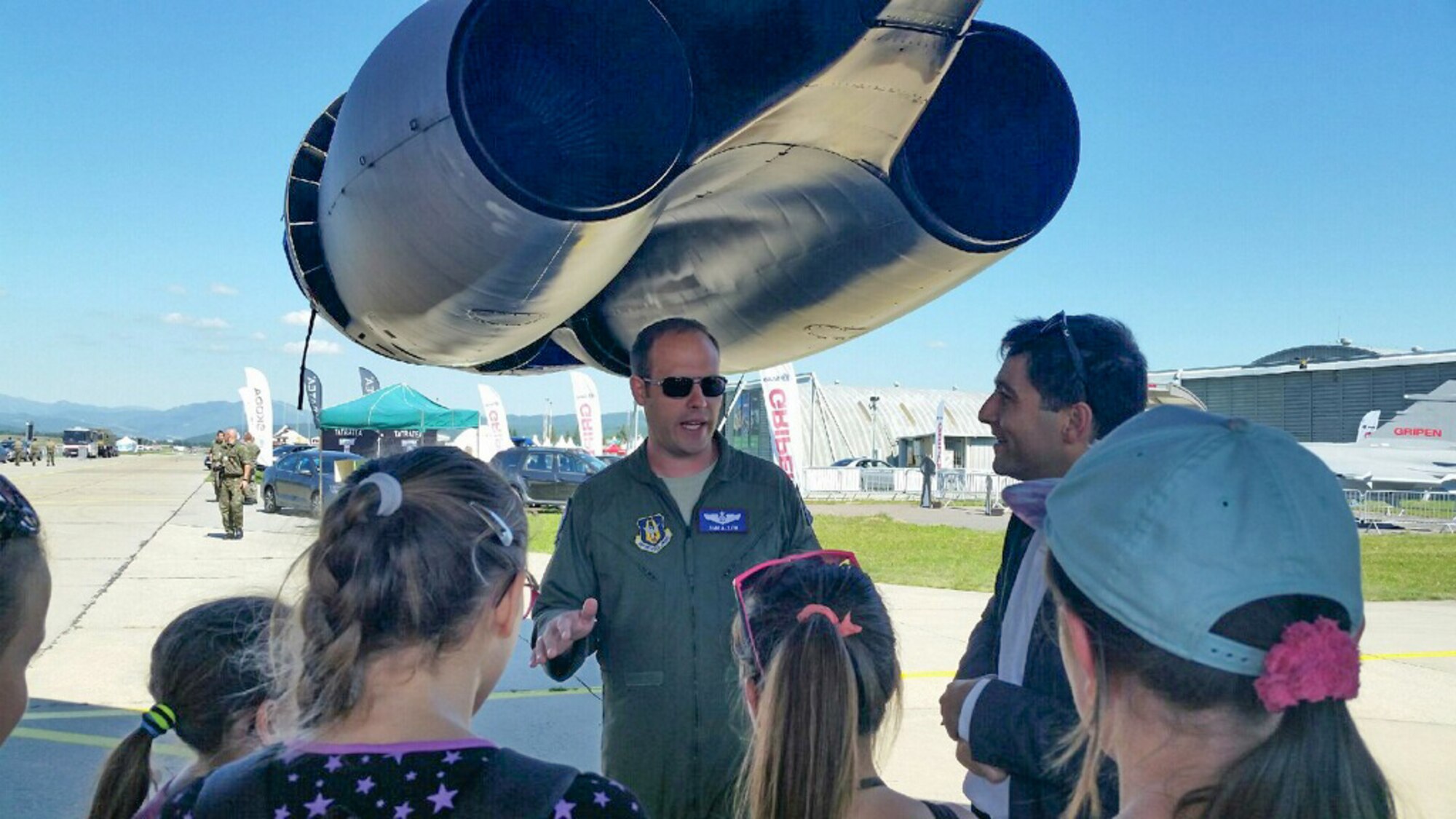 U.S. Air Force Maj. Sam Allen, a B-52H Stratofortress aircrew member from the Reserve 93rd Bomb Squadron, answers questions from a group of Slovakian school students during a tour of the bomber on Aug. 26, 2016, Sliač, Slovakia. The students were given a special tour of the aircraft prior to the Slovak International Air Fest. (U.S. Air Force photo by Master Sgt. Andrew Branning/Released)