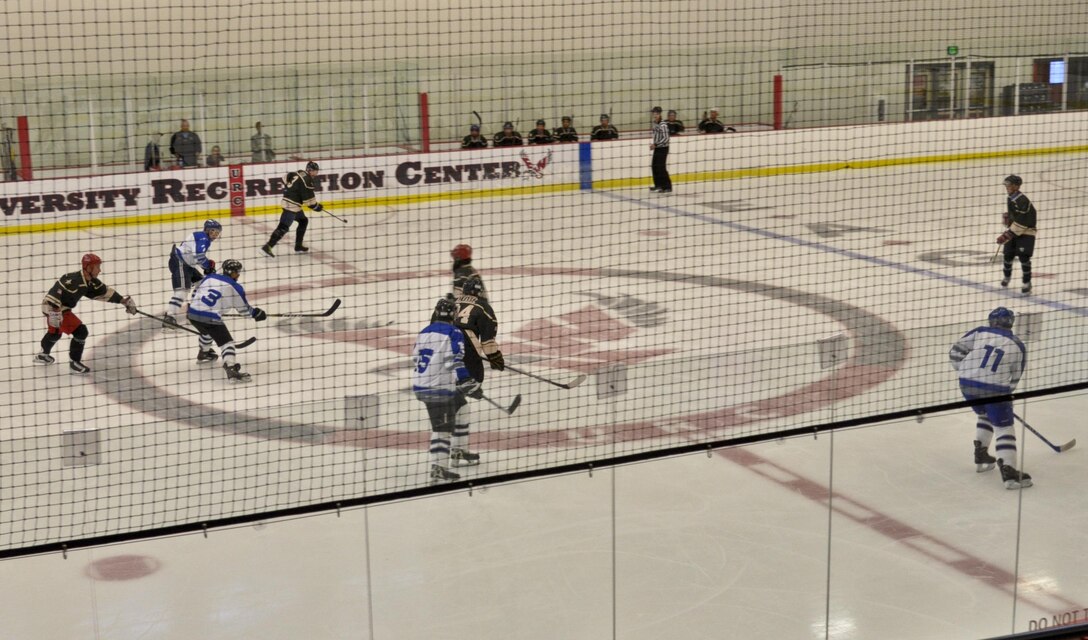 Players from the Fairchild Falcons hockey team, blue, play against the Joint Base Lewis-McChord team, black, during the Veterans Hockey Game Aug. 27, 2016 at Eastern Washington University Recreational Center in Cheney, Wash. “This game helped get our team ready to compete at the Armed Services Hockey Tournament against the caliber of teams we will be facing when there,” said Master Sgt. Rory McKinnon, 92nd Force Support Squadron career assistance advisor and Falcons player. (U.S. Air Force Photo/Airman 1st Class Taylor Shelton)