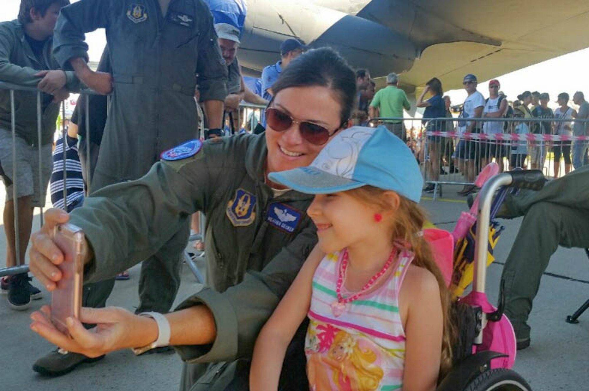 U.S. Air Force Maj. Heather Decker, a B-52 Stratofortress aircrew member with the 93rd Bomb Squadron, takes a selfie with a Slovak girl on Aug. 27, 2016 during the Slovak International Air Fest held in Sliač, Slovakia. The air show featured displays and aerial demonstrations with aircraft from across Europe and Asia; the B-52, from the Reserve 307th Bomb Wing, was the only U.S. representative at the event and was voted the best static display for the event. (U.S. Air Force photo by Master Sgt. Andrew Branning/Released)