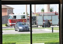A Schriever Fire Department fire truck pulls up to the Tierra Vista Community Center at Schriever Air Force Base, Colorado, during an exercise Friday, Aug. 26, 2016. The Schriever Fire Department was responding to a mock drowning incident at the pool. (U.S. Air Force photo/Brian Hagberg)