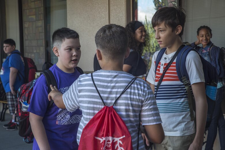 Students get re-acquainted with one another after a long summer during Matthew C. Perry’s first day of school on Marine Corps Air Station Iwakuni, Japan, Aug. 29, 2016. This school year differs from others as it is the last time the first day of school will be held at the current facility. Students will transition to the newly constructed schools halfway through the school year. (U.S. Marine Corps photo by Cpl. Nathan Wicks)
