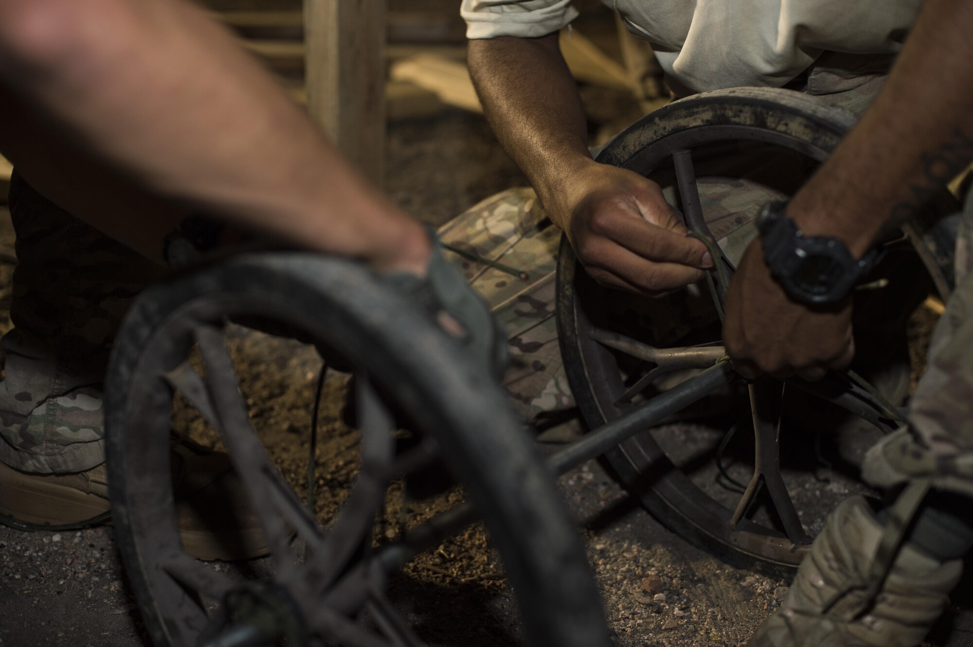 Airmen from the 790th Missile Security Forces Squadron secure wheels to an axel in a team building event during the annual Crow Creek Challenge at F.E. Warren Air Force Base, Wyo., Aug. 26, 2016. This event challenged participants’ ability to work as a team and assemble a cart to transport sandbags up a hill. The 22nd CCC tested defenders’ mission capabilities as a team in a physically and mentally stressful environment. (U.S. Air Force photo by Staff Sgt. Christopher Ruano)