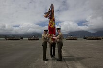 Lt. Gen. John A. Toolan, the outgoing commander of U.S. Marine Corps Forces, Pacific, passes the unit colors to Lt. Gen. David H. Berger during a change of command ceremony at Marine Corps Base Hawaii, Aug. 26, 2016. The change of command ceremony represents the transfer of responsibility and authority between commanders. (U.S. Marine Corps photo by Lance Cpl. Matthew Casbarro/Released)