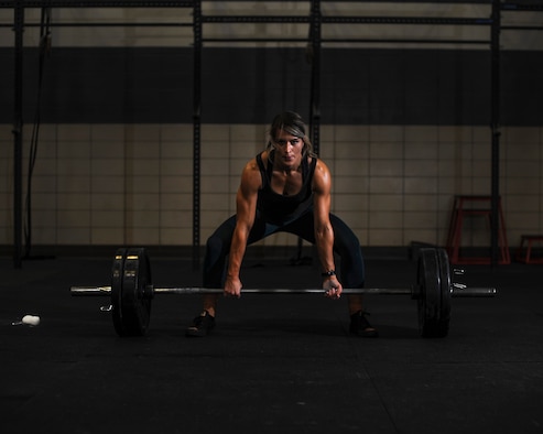 U.S. Air Force Staff Sgt. Macy Benjamin, 355th Contracting Squadron contract administrator, prepares to perform a dead lift at the Haeffner Fitness and Sports Center at Davis-Monthan Air Force Base, Ariz., Aug. 25, 2016. Benjamin uses weightlifting as a personal escape from everyday stressors. (U.S. Air Force photo by Airman 1st Class Ashley N. Steffen)