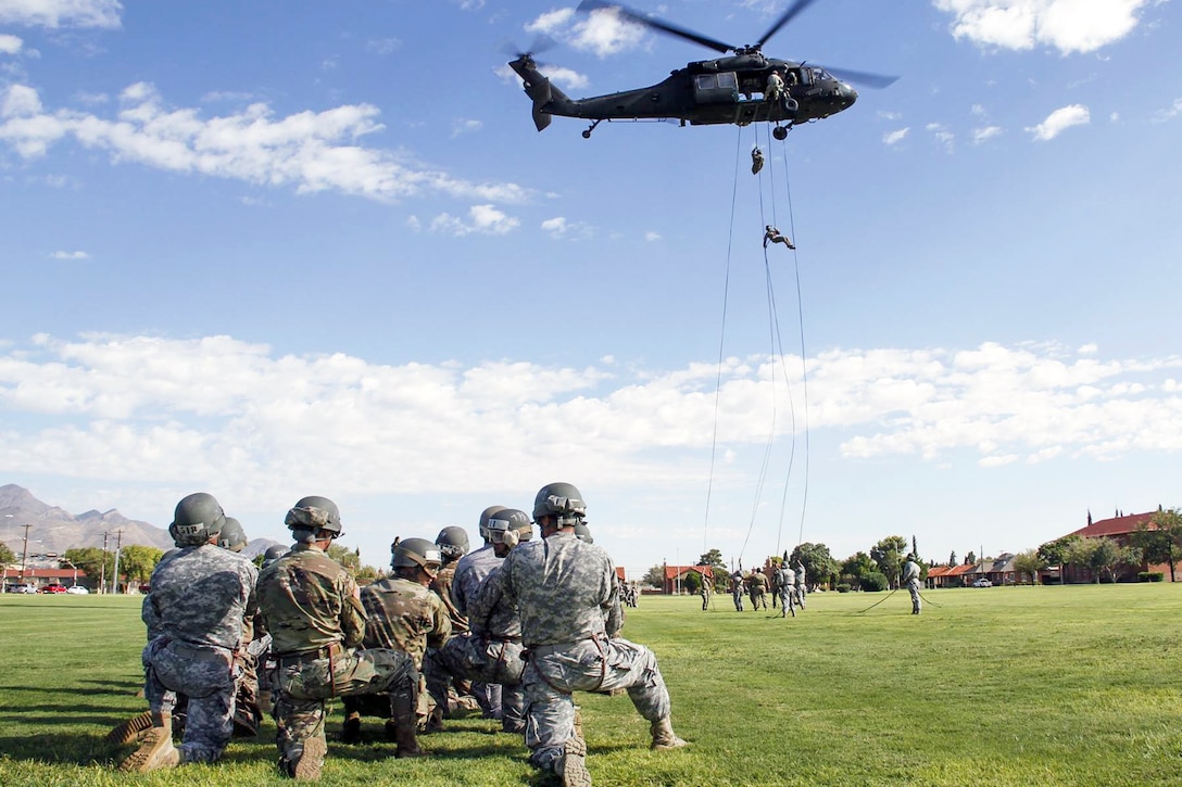 Soldiers rappel from a UH-60 Black Hawk helicopter during air assault training at Fort Bliss, Texas, Aug. 23, 2016. Army photo by Abigail Meyer