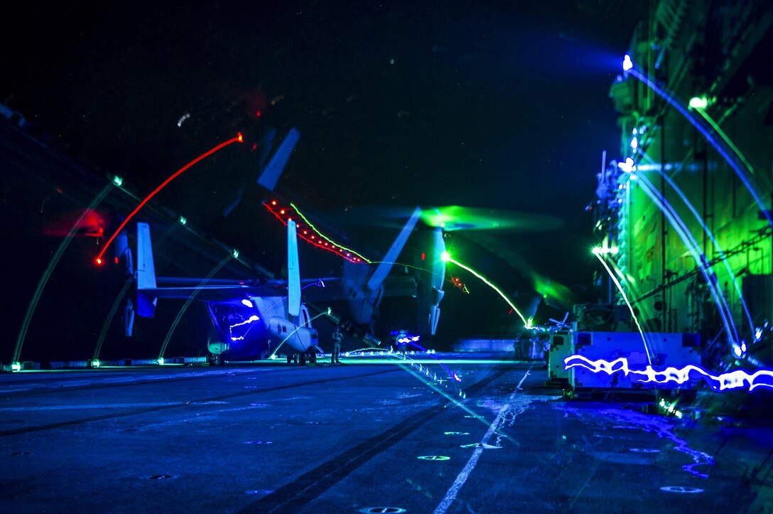 A Marine Corps MV-22 Osprey aircraft idles on the flight deck of the amphibious assault ship USS Boxer in the Pacific Ocean, Aug. 26, 2016. The Boxer is operating in the U.S. 3rd Fleet area of operations. The Osprey is assigned to the 13th Marine Expeditionary Unit. Navy photo by Petty Officer 3rd Class Michael T. Eckelbecker
