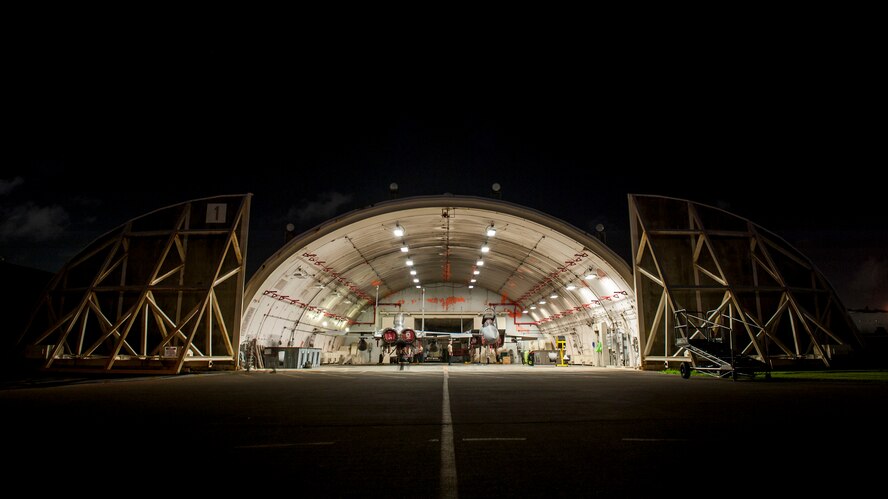 Maintainers assigned to the 67th Aircraft Maintenance Unit tow F-15 Eagles into an aircraft hangar Aug. 24, 2016, at Kadena Air Base, Japan. Swing shift maintainers service and repair all fighter aircraft every night in order to sustain Kadena’s constant mission readiness. (U.S. Air Force photo by Senior Airman Peter Reft)