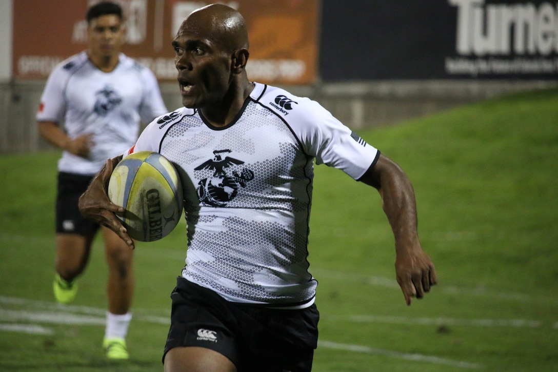 Marine Corps Sgt. Timoci Kawa of MCB Hawaii runs in for the score during the Marine's 19-14 victory over Coast Guard.