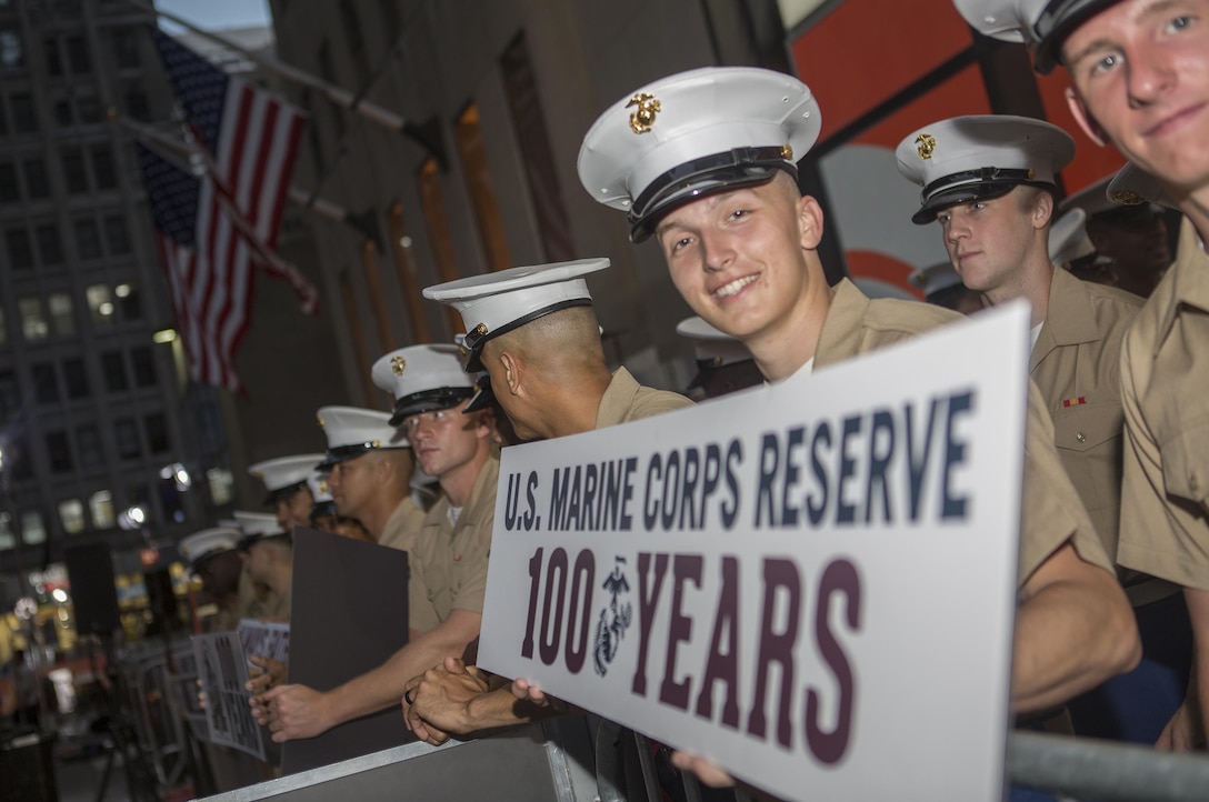 Reserve Marines hold signs at the Today Show in Rockefeller Center, during the celebration of the U.S. Marine Corps Reserve Centennial, Aug. 29, 2016. The Marines are commemorating 100 years of rich history, heritage, esprit de corps, and a bond with not only New York City but with all communities across the U.S. The celebration brings awareness to the Reserve’s essential role as a crisis response force and expeditionary force in readiness that is always prepared to augment the active component. (U.S. Marine Corps photo by Sgt. Sara Graham)