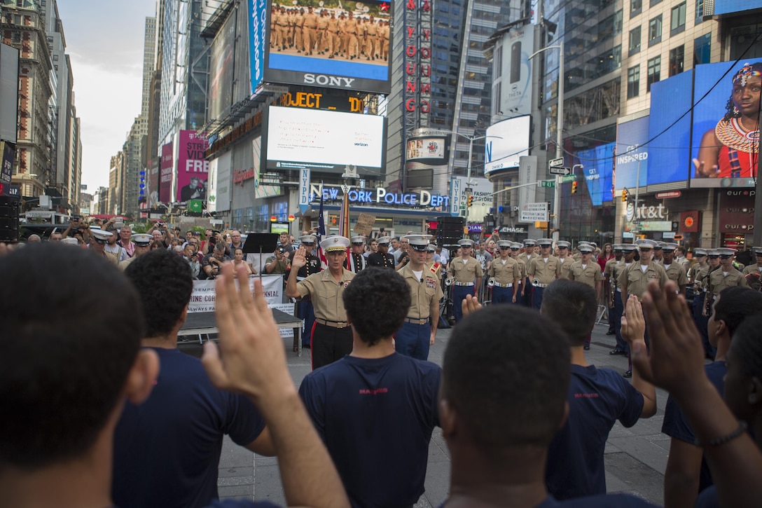 Lt. Gen. Rex C. McMillian, commander of Marine Forces Reserve and Marine Forces North, gives the oath of enlistment to potential recruits during the U.S. Marine Corps Forces Reserve Centennial celebration at Times Square, Aug. 29, 2016. For 100 years, the Marine Corps Reserve has answered the call, serving as our nation’s crisis response force and expeditionary force in readiness. The centennial celebration is a way to honor this selfless service and celebrate the Marine Corps’ rich history, heritage and esprit de corps. (U.S. Marine Corps photo by Sgt. Sara Graham)