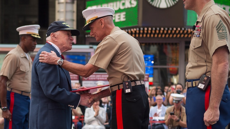 Lt. Gen. Rex C. McMillian recognizes retired Col. Jon Mendes for his distinguished service in the Marine Corps during the U.S. Marine Corps Reserve Centennial celebration at Times Square, New York, Aug. 29, 2016. For 100 years, the Marine Corps Reserve has answered the call, serving as our nation’s crisis response force and expeditionary force in readiness. The centennial celebration is a way to honor this selfless service and commemorate the Marine Corps’ rich history, heritage and esprit de corps. It also provides an opportunity to thank their families, employers and community for their continued support.